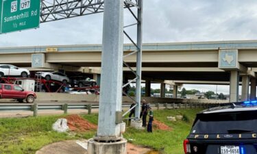 Police say a man died after apparently hanging himself from the metal supports for the Interstate 30 signs at Richmond Road