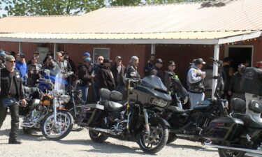 A line pours out the door of the Rat Hole bar in Knob Noster