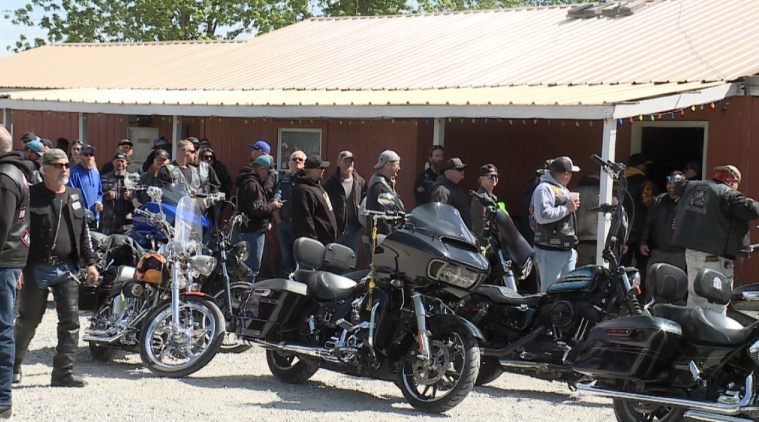 <i>KSHB via CNN Newsource</i><br/>A line pours out the door of the Rat Hole bar in Knob Noster