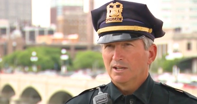 <i>KCCI via CNN Newsource</i><br/>A tense situation unfolded in Des Moines on May 25 when a man perched precariously outside the guardrail of the 5th Avenue parking garage