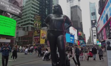 A new statue is turning heads in Times Square. The 12-foot tall bronze sculpture was unveiled last week.