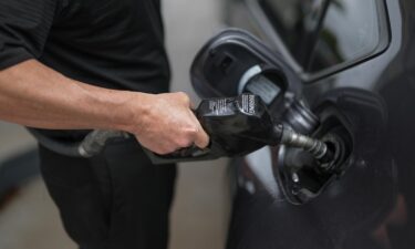 A customer pumps gas into their vehicle at a Shell station on April 10