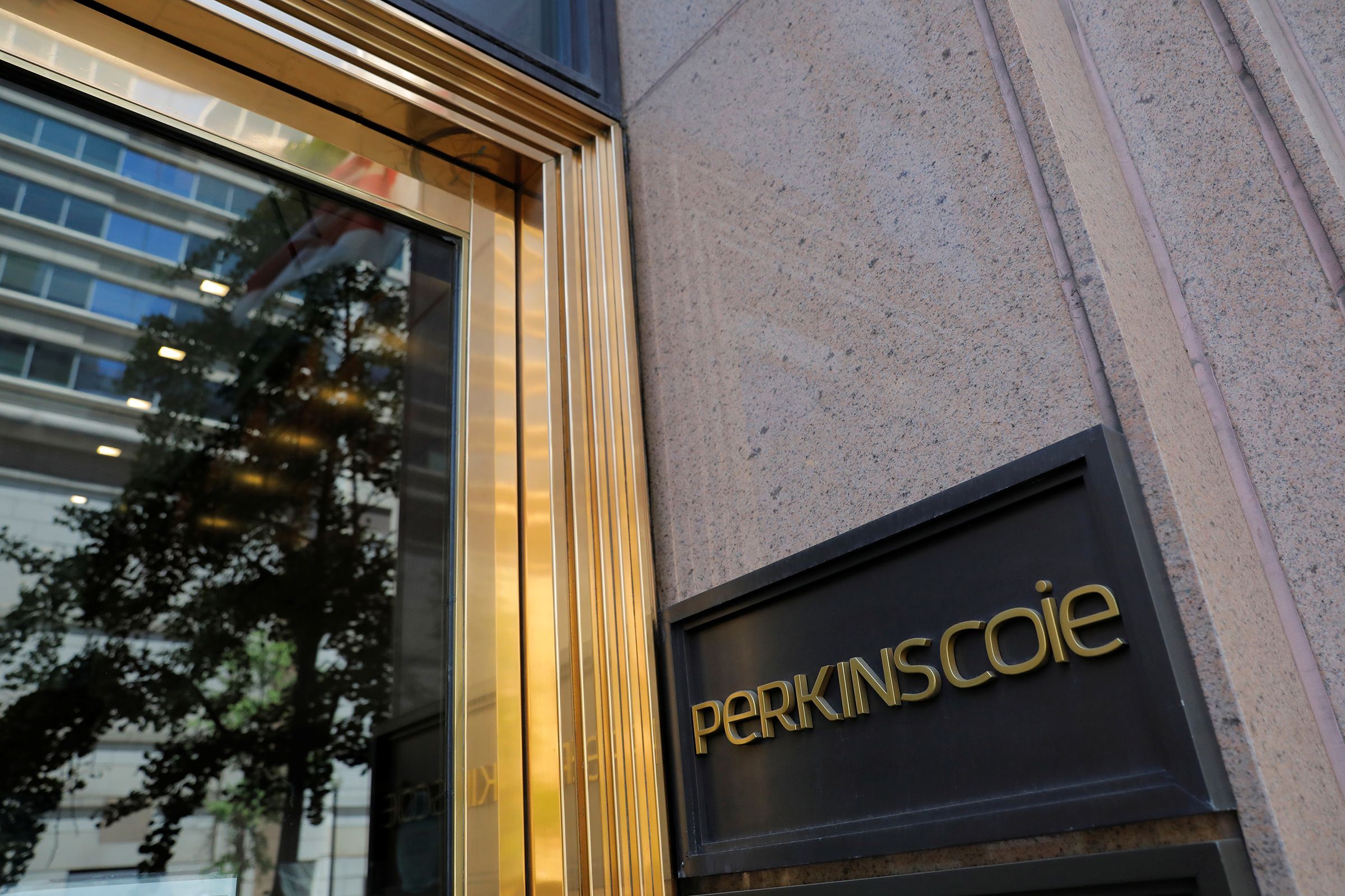 <i>Andrew Kelly/Reuters/File via CNN Newsource</i><br/>Signage is seen outside of the law firm Perkins Coie at their legal offices in Washington