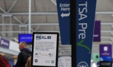 A sign outside a TSA checkpoint at Chicago O'Hare International Airport informs travelers of the REAL ID deadline.