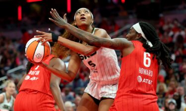 Angel Reese (center) had 12 points and 17 rebounds in the Chicago Sky's loss to the Indiana Fever on Saturday.