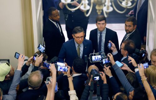 Speaker of the House Mike Johnson speaks to reporters as he departs for the White House as ongoing negotiations between House leadership