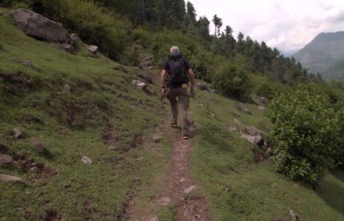 A soldier stands guard at the Hajir Pir pass close to the Line of Control on May 4