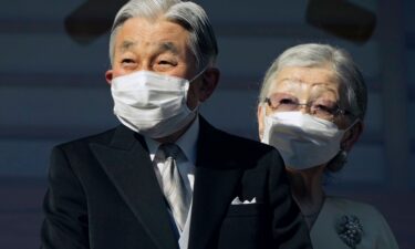 Japan's Emperor Emeritus Akihito and Empress Emerita Michiko greet well-wishers at the Imperial Palace in Tokyo in January 2023.