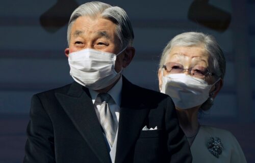 Japan's Emperor Emeritus Akihito and Empress Emerita Michiko greet well-wishers at the Imperial Palace in Tokyo in January 2023.
