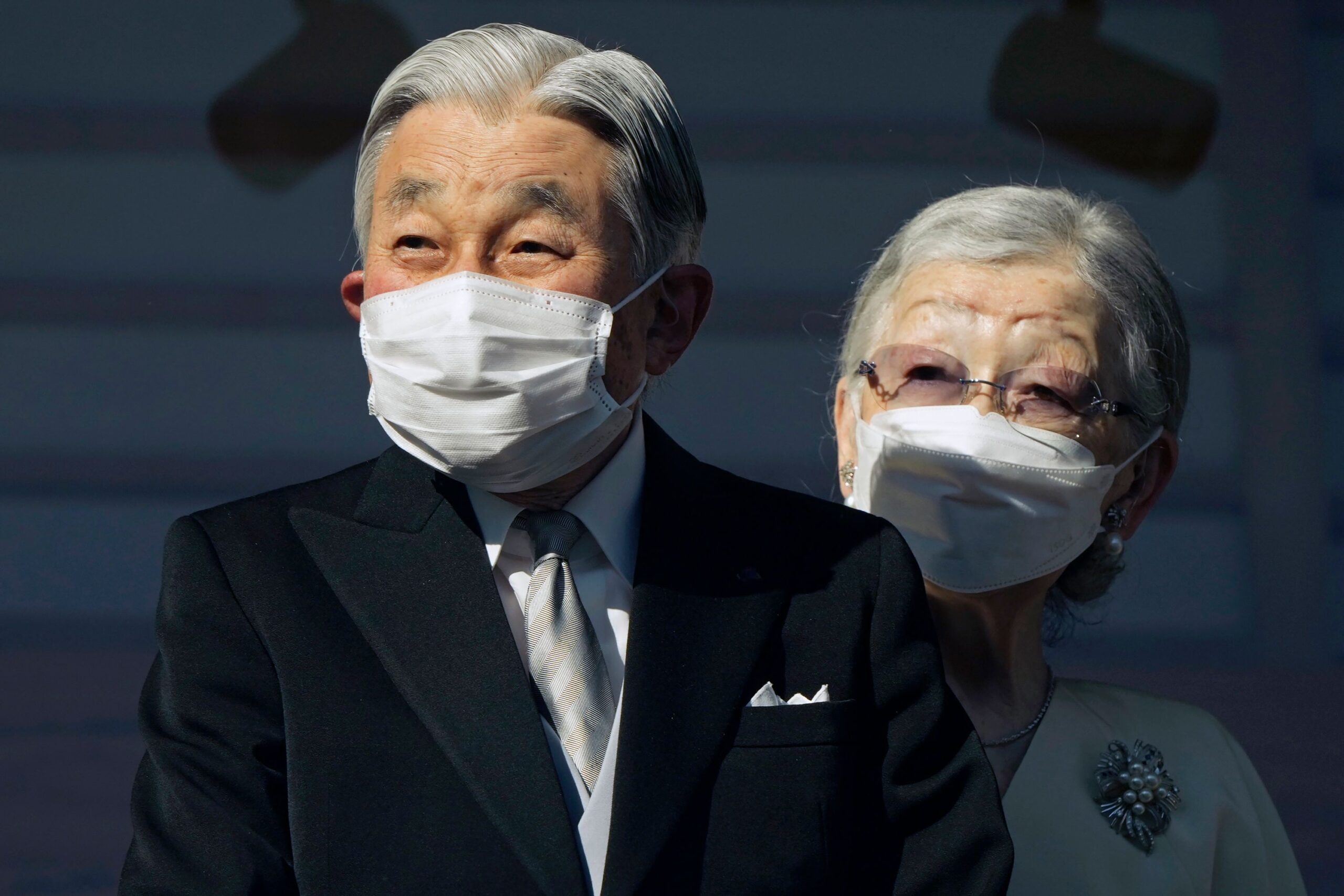 <i>Franck Robichon/AP via CNN Newsource</i><br/>Japan's Emperor Emeritus Akihito and Empress Emerita Michiko greet well-wishers at the Imperial Palace in Tokyo in January 2023.