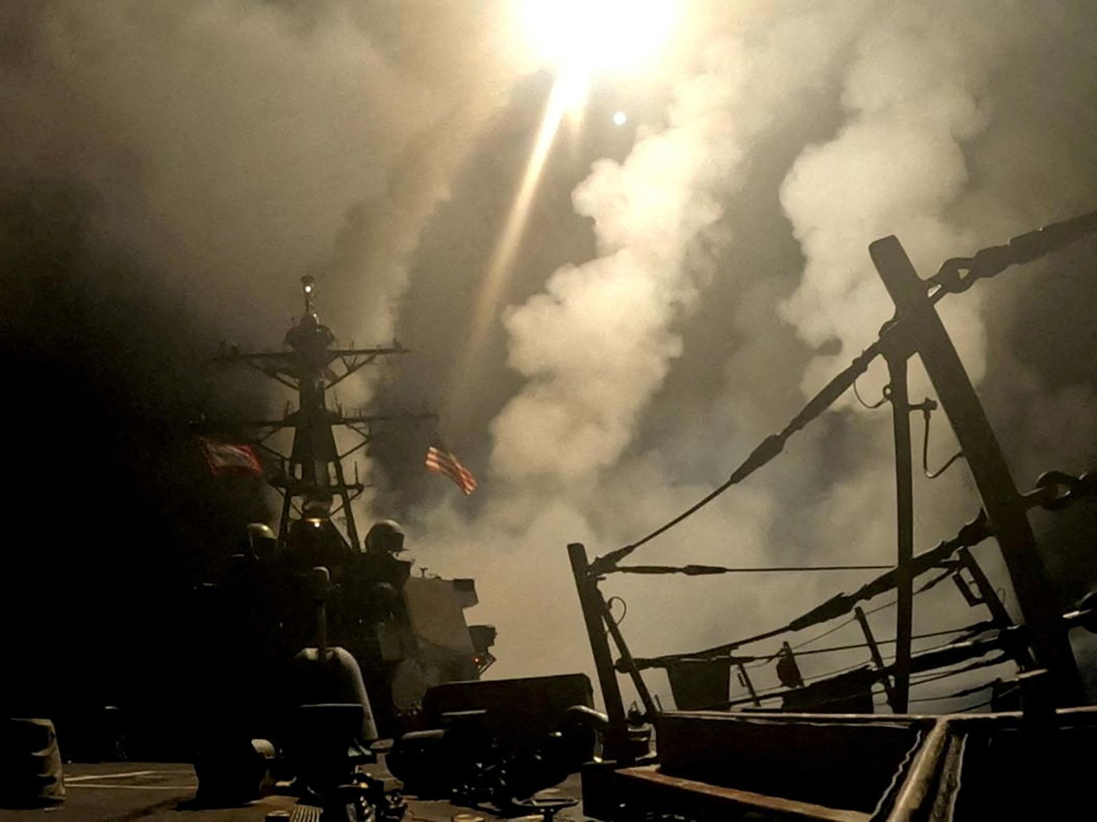 <i>US Central Command/Handout/Reuters via CNN Newsource</i><br/>A ship fires missiles at an undisclosed location after President Donald Trump launched military strikes against Yemen's Iran-aligned Houthis in this screengrab obtained from a handout video released on March 15.
