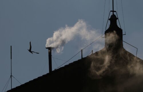 White smoke rises from the chimney on the Sistine Chapel