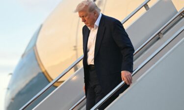 US President Donald Trump disembarks from Air Force One upon arrival at Joint Base Andrews in Maryland