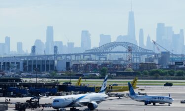 The New York City skyline is seen behind Newark Liberty International Airport in Newark