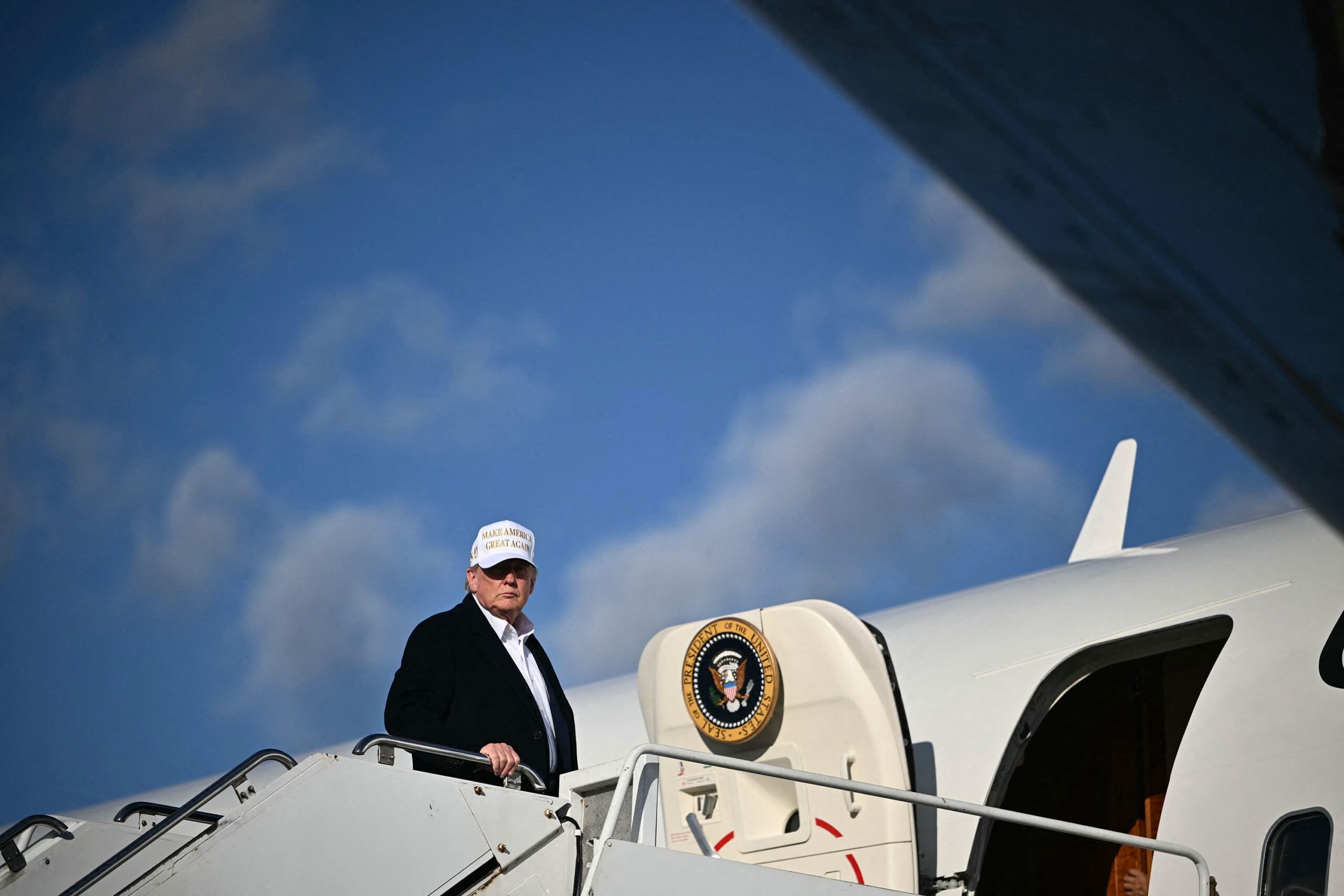 <i>Mandel Ngan/AFP/Getty Images via CNN Newsource</i><br/>US President Donald Trump boards Air Force One upon departure at Morristown Municipal Airport in Morristown
