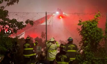 Firefighters battle a blaze at a multi-story mattress warehouse in Baltimore.
