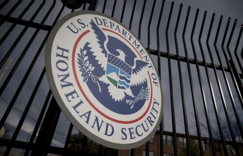 The U.S. Department of Homeland Security (DHS) seal hangs on a fence at the agency's headquarters in Washington