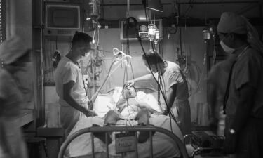 Sapporo University Professor Juro Wada examines Nobuo Miyazaki after Japan's first heart transplant operation at the Sapporo University Hospital on August 9