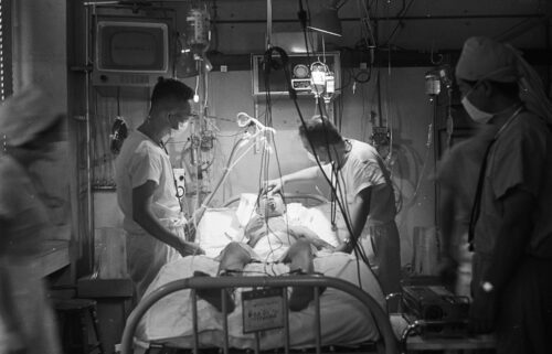 Sapporo University Professor Juro Wada examines Nobuo Miyazaki after Japan's first heart transplant operation at the Sapporo University Hospital on August 9