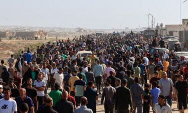 Palestinians gather near an aid distribution site run by the US-backed Gaza Humanitarian Foundation in Rafah