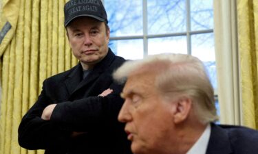 Elon Musk listens to President Donald Trump speak in the Oval Office of the White House in Washington
