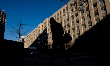 A pedestrian near a General Services Administration (GSA) building in Washington