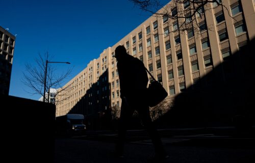 A pedestrian near a General Services Administration (GSA) building in Washington