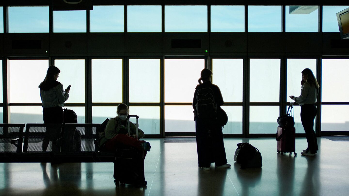 <i>Eduardo Munoz/Reuters via CNN Newsource</i><br/>People wait for the air train to connect with their flights at Newark Liberty International Airport on May 12.