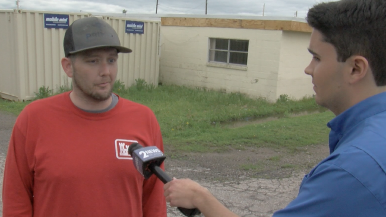 <i>KJRH via CNN Newsource</i><br/>2 News Oklahoma's Brodie Myers listens to Barnsdall resident Robert Rayborn.