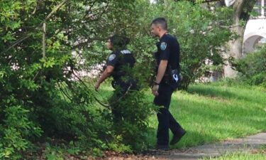 Police search around a Shreveport home after the owners returned from a trip and discovered someone had moved in.