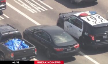 Los Angeles police are in pursuit of a reckless driver in the Mid-City area. SkyCal was overhead when the driver pulled up behind another LAPD patrol car at an intersection.