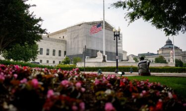 A person rests in front of the US Supreme Court on June 5 in Washington