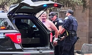 Law enforcement officers detain a suspect after an attack that injured multiple people in Boulder