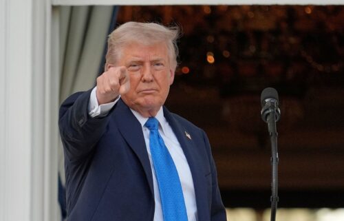 President Donald Trump gestures after speaking during a summer soiree on the South Lawn of the White House on June 4.  Trump signed a proclamation Wednesday evening to ban travel from several countries to the US
