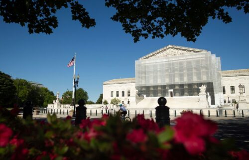 Construction scaffolding covers the facade of the Supreme Court in Washington