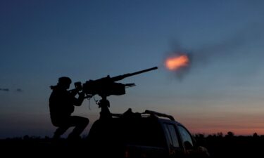 A Ukrainian Armed Forces serviceman fires a machine gun towards a Russian drone in the Kharkiv Region of Ukraine on June 2.