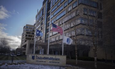 Flags fly at half mast in front of UnitedHealthcare headquarters in Minnetonka