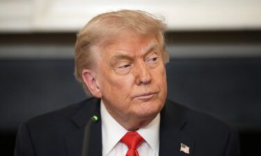 President Donald Trump attends a meeting with the Fraternal Order of Police in the State Dinning Room of the White House