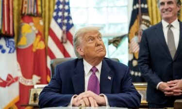 U.S. President Donald Trump sits in the Oval Office at the White House