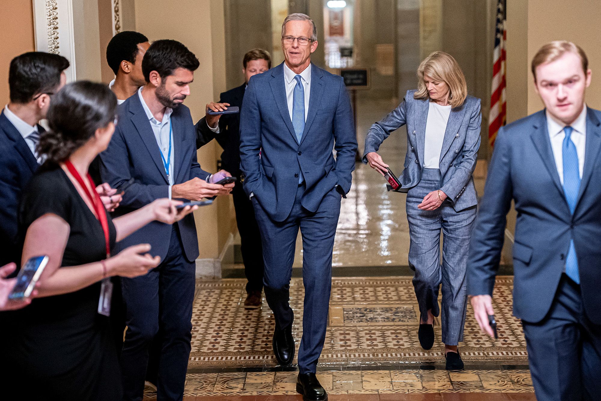 Senate Majority Leader John Thune and Sen. Lisa Murkowski (R-AK) walk to the US Senate floor, July 1, 2025.