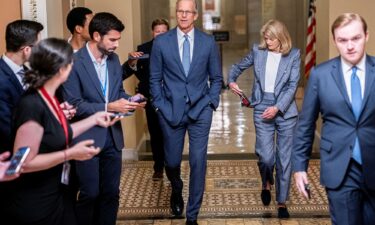 Senate Majority Leader John Thune and Sen. Lisa Murkowski (R-AK) walk to the US Senate floor