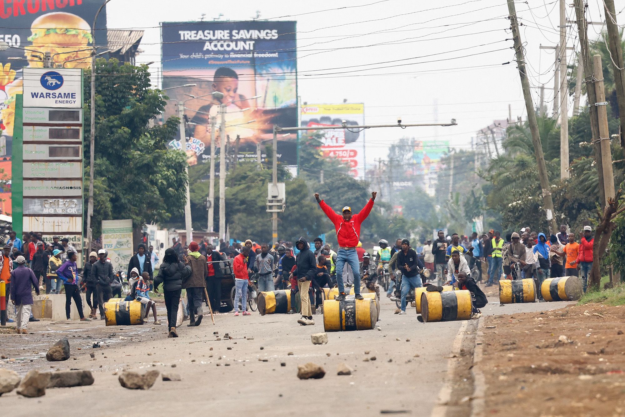 <i>Thomas Mukoya/Reuters via CNN Newsource</i><br/>A demonstrator stands on a barricade cylinder during clashes with riot police in Nairobi on July 7.