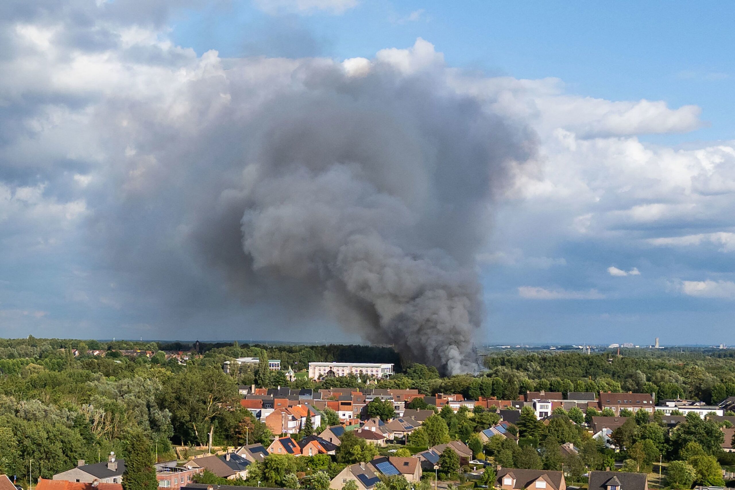 <i>Tom GoyvaertsP/Belga/AFP via Getty Images via CNN Newsource</i><br/>Smoke billows above the site of the Tomorrowland electronic music festival in Boom