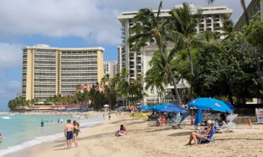 Beachgoers gather in Waikiki after authorities downgraded earlier tsunami warnings following an earthquake off Russia’s Kamchatka Peninsula.