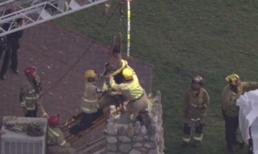 Los Angeles firefighters on Tuesday rescued a woman who was trapped inside of a small chimney at a park in San Fernando.