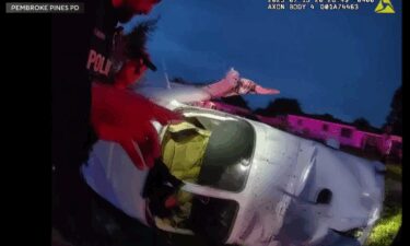 Newly released police body camera video shows the frantic efforts of Pembroke Pines Police to rescue a family moments after their small plane crashed in a Pembroke Pines neighborhood.
