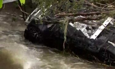 A car fell into a giant hole in the road in Menomonee Falls.