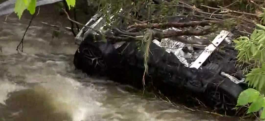 <i>WISN via CNN Newsource</i><br/>A car fell into a giant hole in the road in Menomonee Falls.