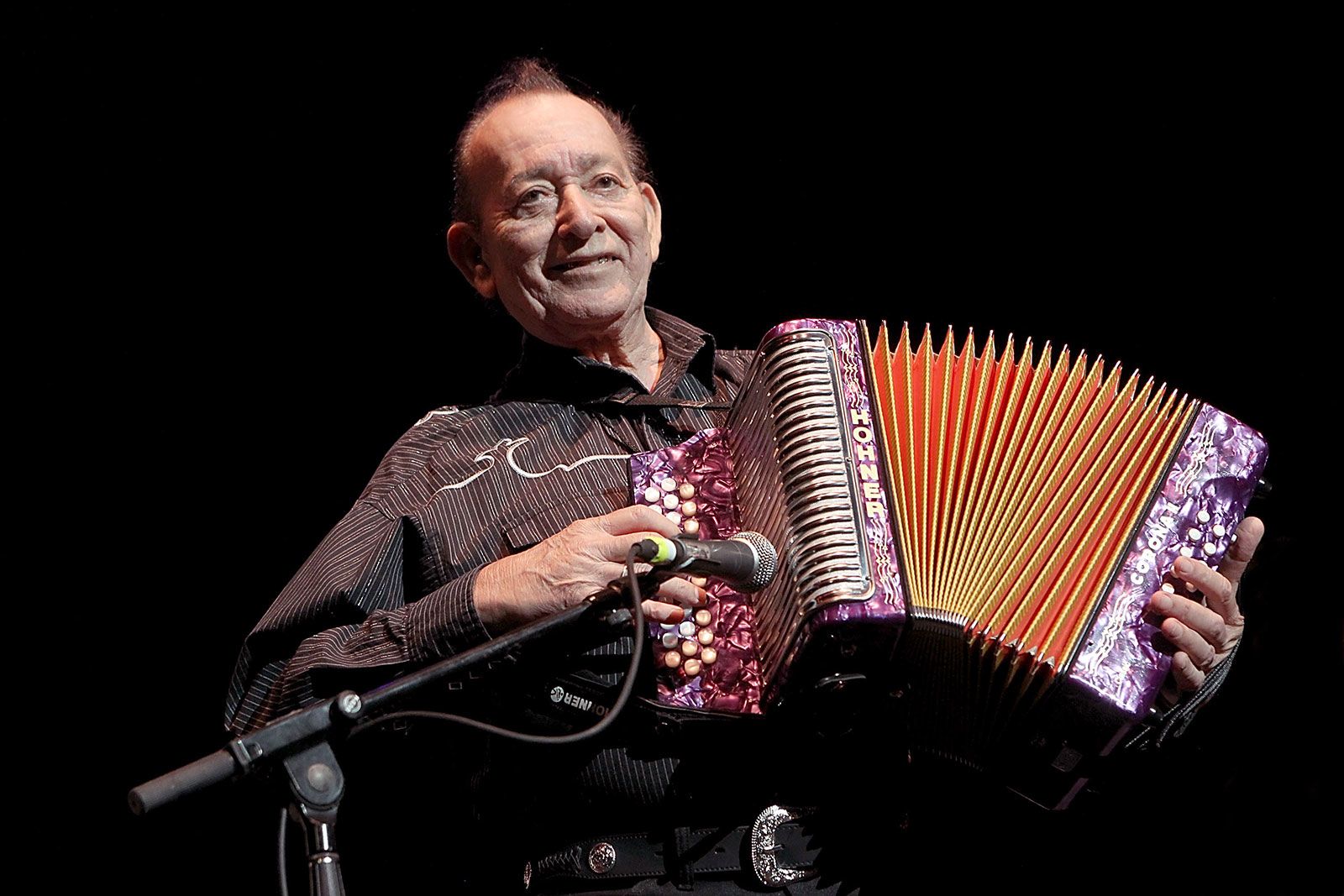 <i>Gary Miller/FilmMagic/Getty Images via CNN Newsource</i><br/>Musician Flaco Jimenez performs during the Concert For Central Texas Fire Relief at The Frank Erwin Center on October 17