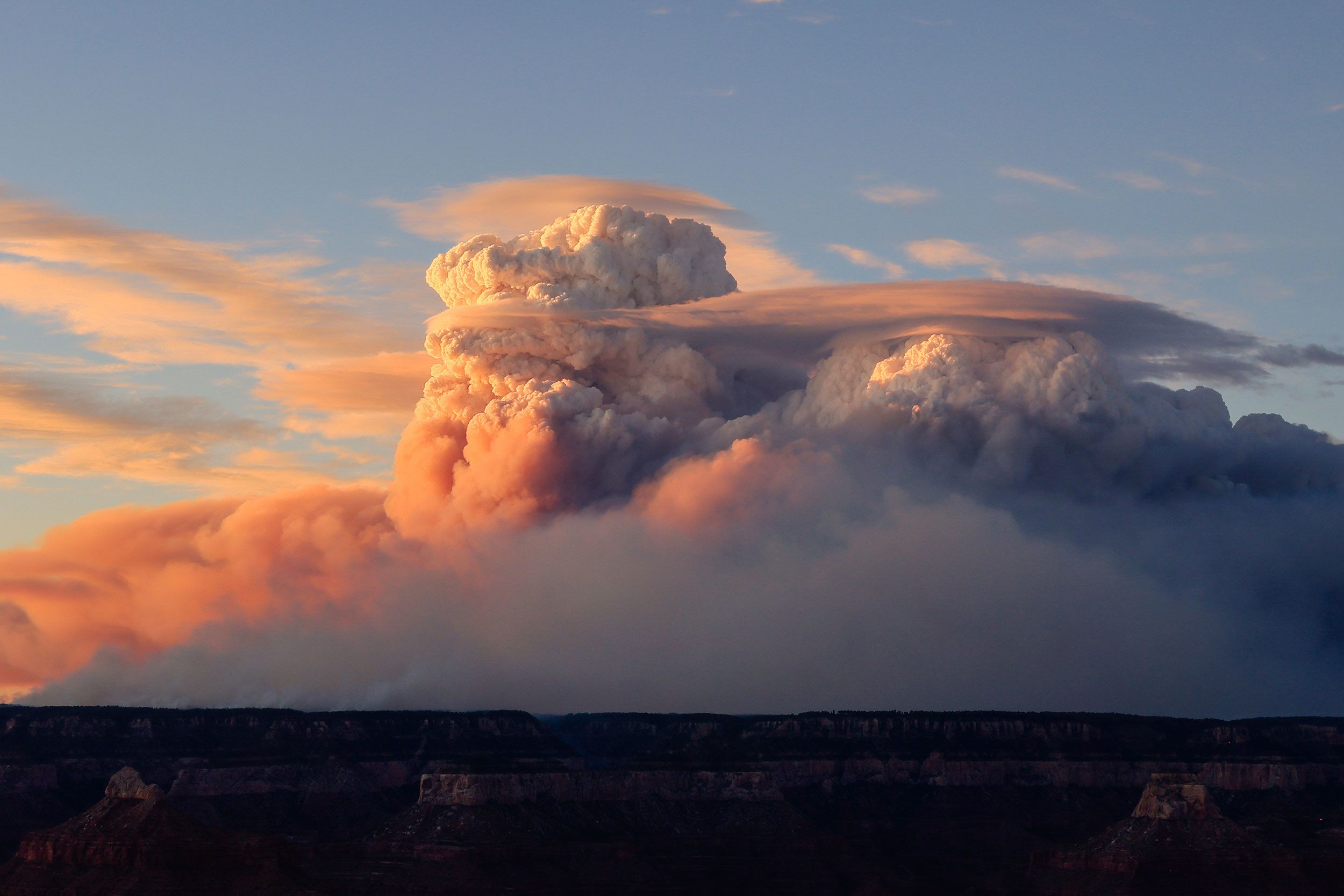 Pyrocumulus clouds formed by the Dragon Bravo Fire are seen at the Grand Canyon in northern Arizona on Sunday